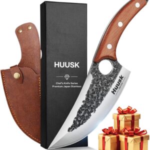 Japanese-style HUUSK chef knife with hammered stainless steel blade, wooden handle, leather sheath, and black gift box displayed on a white background.